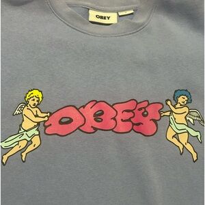 Light blue OBEY crewneck sweatshirt size medium